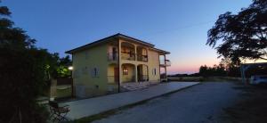 a house with a balcony on top of it at Villa Marianna in Vasto