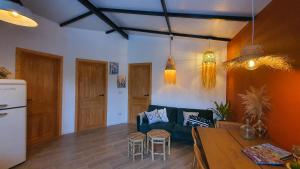 a living room with a couch and a table at La Estación del Amor - Casa Rural con private pool in Alora