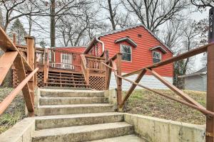 a red house with stairs in front of a house at Indiana Vacation Rental Near Lake Michigan in Valparaiso