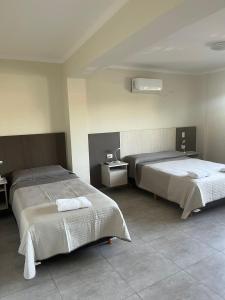 a bedroom with two beds in a room at Departamento Ciudad de Tupungato in Tupungato