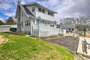 a large white house with a large yard at New! The Docks @ Waterside - Lake Front Hot Tub! in Akron