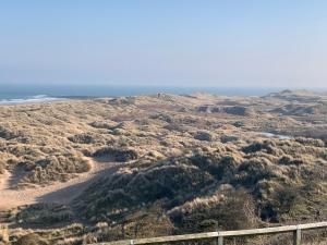 an aerial view of the desert and the ocean at Brada View Bamburgh in Bamburgh