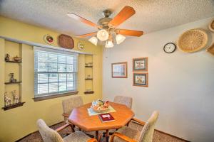 a dining room with a table and a ceiling fan at Midland Vacation Rental Close to Downtown in Midland