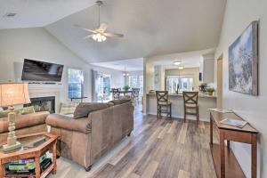a living room with a couch and a table at Family-Friendly Home Near Destin Beaches in Niceville