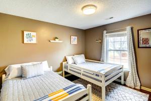 a bedroom with two beds and a window at Browns Summit Vacation Rental with Fire Pit! in Monticello