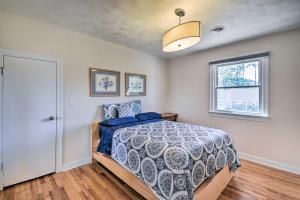 a bedroom with a bed and a window at Spacious Chesapeake Home with Pool Table! in Chesapeake