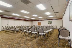 a large room with a bunch of chairs in it at Best Western Plus Forest Park Inn in Gilroy