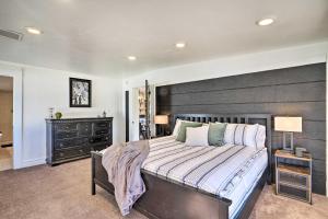a bedroom with a large bed with a wooden headboard at Spacious Murray Home Near Ski Resorts! in Murray