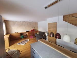 a living room with a couch and a table at Luxury chalet in Tauplitz Styria with sauna and swimming pond in Bad Mitterndorf