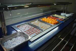 a buffet line with many different types of food at Alberg L'Escala Xanascat in L'Escala