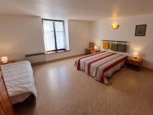 a large bedroom with a bed and a window at Gîte de charme dans ferme lorraine avec jardin clos, à proximité de sentiers et base de loisirs - FR-1-584-32 in Pulney