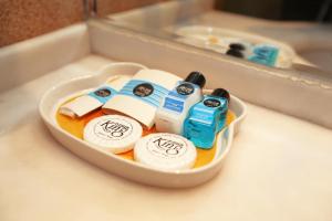 a container filled with toiletries on a counter at King Hotel Cankaya in Ankara