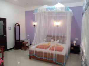 A bed or beds in a room at Littleadems View
