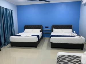 Кровать или кровати в номере VILLA TASIK TONGKANG KELI LANGKAWI