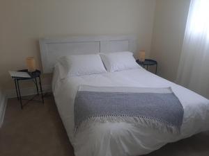 Llit o llits en una habitació de La Maison aux Camélias