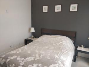 a bedroom with a bed with a white comforter at Entertainment District, Downtown Toronto - 300 Front 1 Bed 1 Bath, City View in Toronto