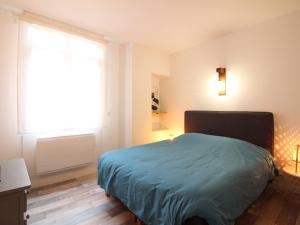 Łóżko lub łóżka w pokoju w obiekcie Appartement Splendide T3 à La Bourboule, Proche Parc Fenestre et Thermes - FR-1-608-239