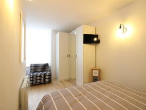 Łóżko lub łóżka w pokoju w obiekcie Appartement Splendide T3 à La Bourboule, Proche Parc Fenestre et Thermes - FR-1-608-239