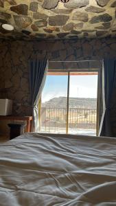 Postel nebo postele na pokoji v ubytování jabal shams view stay نزل إطلالة جبل شمس + 13 fotografií
