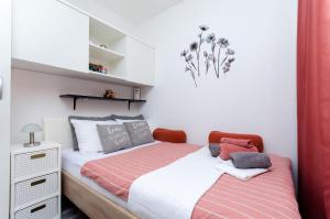 a small bedroom with a bed and a dresser at Apartment Mare in Vrsar