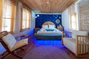 A bed or beds in a room at The Little Prince Boutique Otel