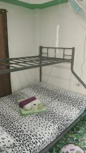 a bunk bed with a tray on the bottom bunk at Ustaris Homestay in Itaytay