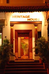 a entrance to a heritage house with a sign on it at Coramandal Heritage in Puducherry