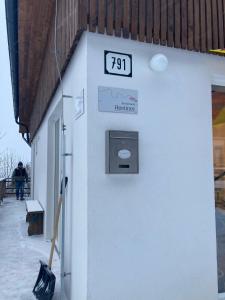 a building with a clock on the side of it at Hostinec u Klačkov in Lubina