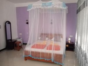 A bed or beds in a room at Littleadems View