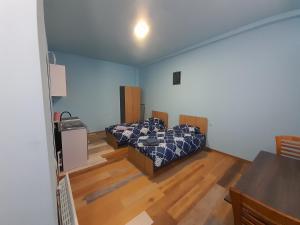 Кровать или кровати в номере Art Guest House in KASKAD