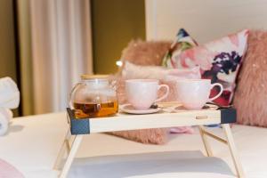a tray with two cups of tea on a table at Mariù Upmarket Accommodation in Nelspruit