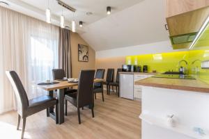 A kitchen or kitchenette at PontJó Apartman Miskolc