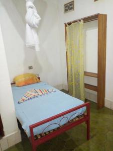 En eller flere senge i et værelse på Maison d'Accueil - Fondation San Filippo Neri