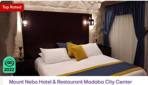 a bedroom with a bed with yellow and blue pillows at Mount Nebo Hotel & Restaurant Madaba City Center in Madaba