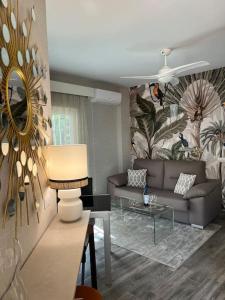 a living room with a couch and a table at Cozy apartment Costa Adeje in Adeje