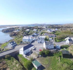 an aerial view of a small town next to the water at Village Way Apartments in Kincasslagh