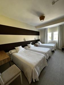 A bed or beds in a room at San Luis