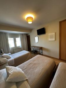 A bed or beds in a room at San Luis