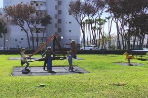 a group of children playing in a park at ALGAIDA BEACHFRONT - Seaview Costa del sol in Sitio de Calahonda