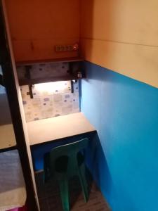 a lego room with a table and a stool at Salty Dog Hostel in Telukdalam
