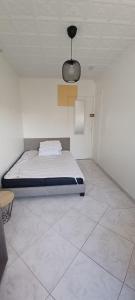 Posteľ alebo postele v izbe v ubytovaní Colocation maison - Villeurbanne près de Lyon