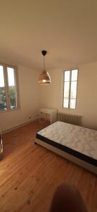 Posteľ alebo postele v izbe v ubytovaní Colocation maison - Villeurbanne près de Lyon