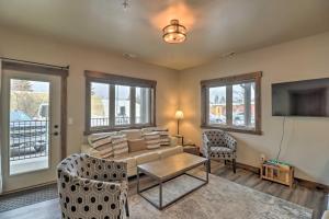 a living room with a couch and a tv at Montana Vacation Rental - Fish, Hike, Ski! in Columbia Falls