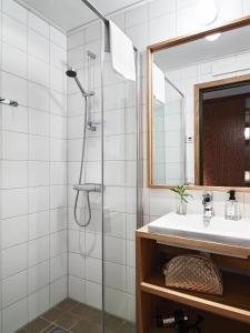 a bathroom with a shower and a sink at Öijared Resort in Floda