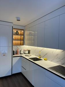 Nhà bếp/bếp nhỏ tại Appartement Wonder 2 au centre de Couvet