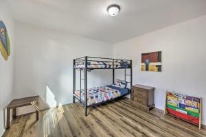 a bedroom with a bunk bed and a wooden floor at Rural Gilmer House with Covered Patio! in Gilmer