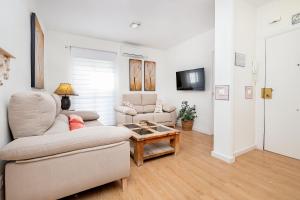 a living room with a couch and a table at BHost - El Indiano in Córdoba