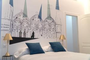 A bed or beds in a room at Cervantes 5 Collection Catedral - Alcántara