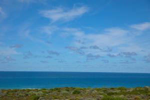 a view of the ocean with the sky and clouds at Southern most tip of Africa apartment with sea views in Agulhas