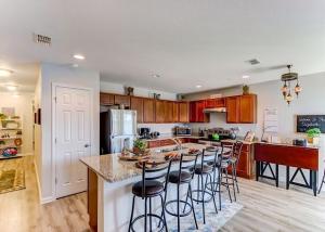 a kitchen with a island with bar stools at The Elizabeth in Jacksonville